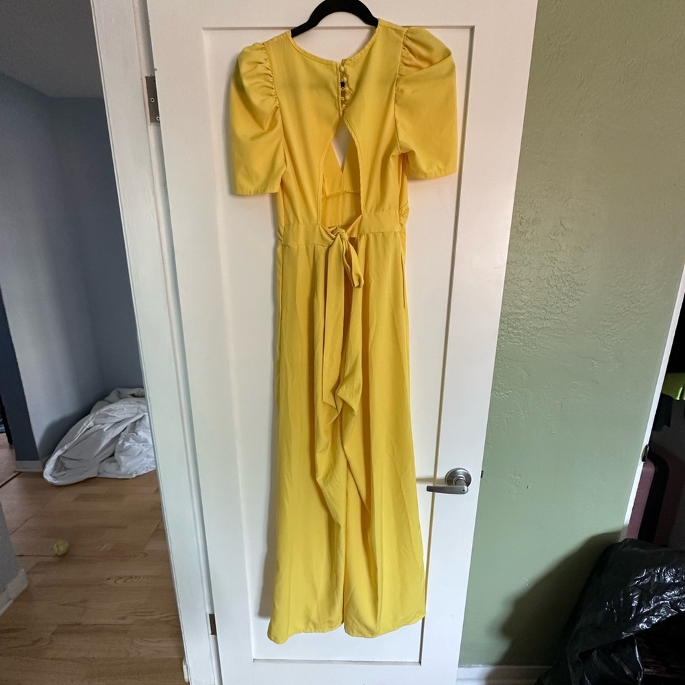 Yellow jumpsuit! Not sure what brand. Bought it online for a wedding outfit.
